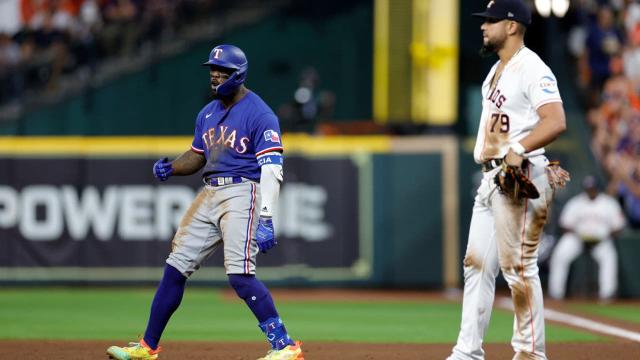 Adolis Garcia of the Texas Rangers celebrates after hitting a solo News  Photo - Getty Images