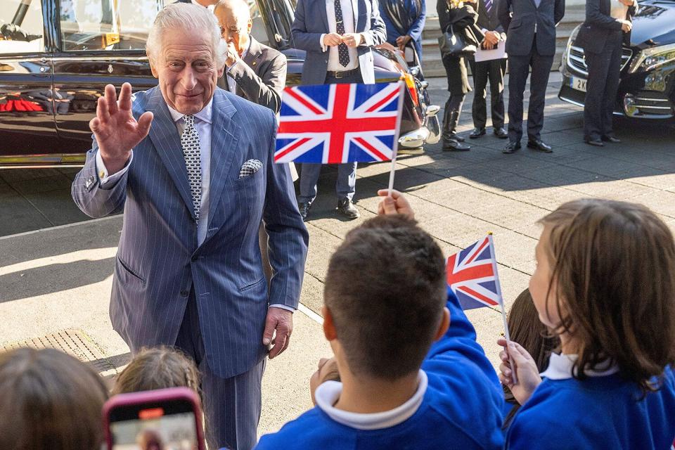 Britain's King Charles III is welcomed as he arrives to meet with members and staff of the association "Project Zero", an organisation dedicated to engaging young people in positive activities, promoting social inclusion and strengthening community cohesion, during a visit of the center in Walthamstow, in east London, on October 18, 2022.