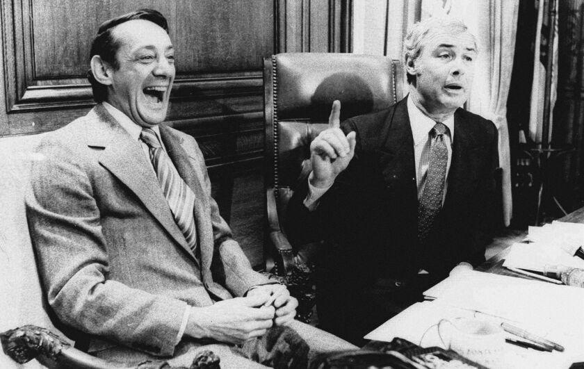 FILE - In this April 1977 file photo, San Francisco Supervisor Harvey Milk, left, and Mayor George Moscone sit together in the mayor's office during the signing of the city's gay rights bill. (AP Photo/File)
