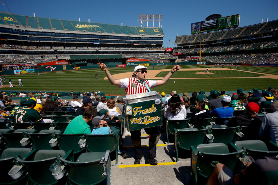 OAKLAND, CA - MAY 25: A hot dog vendor sells hot dogs in the stands during the game between the Oakland Athletics and the Seattle Mariners at the Oakland-Alameda County Coliseum on May 25, 2019 in Oakland, California. The Athletics defeated the Mariners 6-5. (Photo by Michael Zagaris/Oakland Athletics/Getty Images)