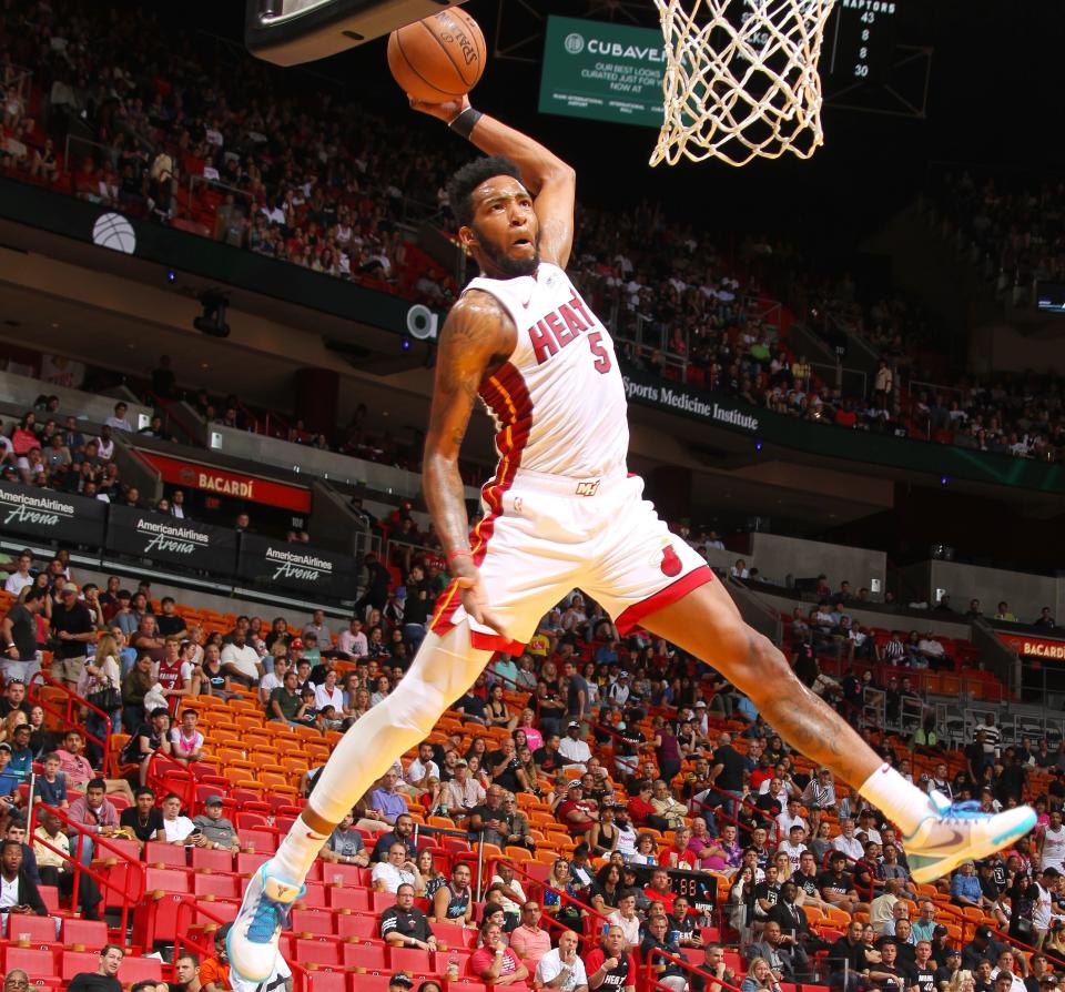 MIAMI, FL - MARCH 10: Derrick Jones Jr. #5 of the Miami Heat slams a dunk during the game against the Toronto Raptors on March 10, 2019 at American Airlines Arena in Miami, Florida. NOTE TO USER: User expressly acknowledges and agrees that, by downloading and or using this Photograph, user is consenting to the terms and conditions of the Getty Images License Agreement. Mandatory Copyright Notice: Copyright 2019 NBAE (Photo by Oscar Baldizon/NBAE via Getty Images)