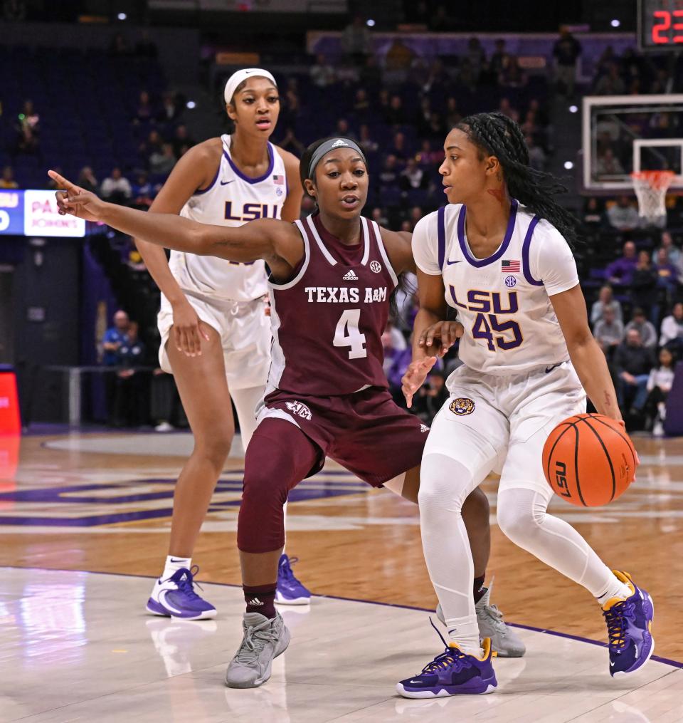 Texas A&M's Kay Kay Green (4) defends against LSU guard Alexis Morris (45) during an NCAA college basketball game Thursday, Jan. 5, 2023, in Baton Rouge, La. (Hilary Scheinuk/The Advocate via AP)