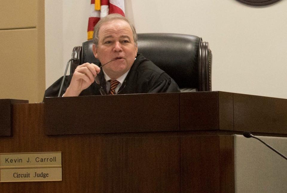 Circuit Judge Kevin Carroll presides over a competency hearing in 2014 in the notorious case of Adam Frasch, a doctor who was convicted in the murder of his wife, Samira Frasch.