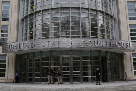 People stand outside the federal courthouse during the arraignment of Joaquin "El Chapo" Guzman in the Brooklyn borough of New York City, New York, U.S. January 20, 2017. REUTERS/Joe Penney