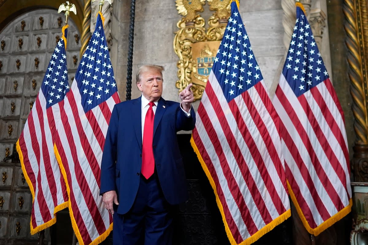 Donald Trump speaks to reporters from Mar-a-Lago on 4 March after the US Supreme Court’s decision in a case that keeps him on presidential election ballots. (AP)