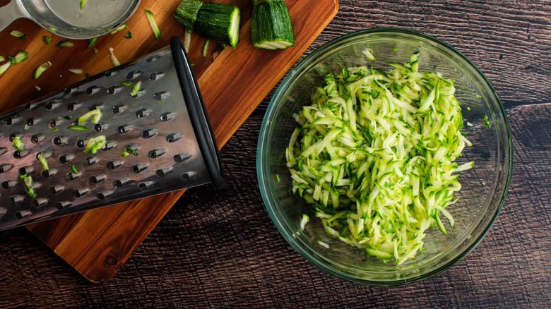 shredded zucchini in glass bowl