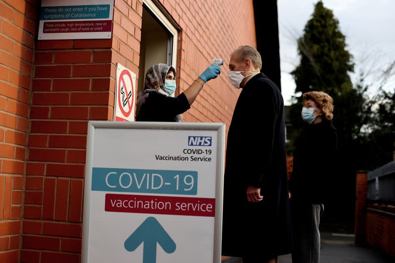 FILE PHOTO: People get injections of Pfizer-BioNTech COVID-19 vaccine in Wolverhampton