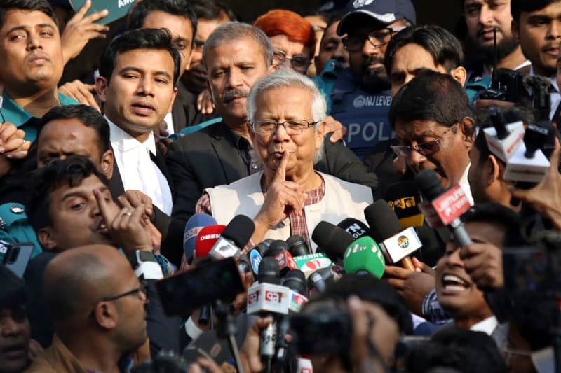 Muhammad Yunus (C), Bangladeshi Nobel Peace Prize winner, gestures to media as he leaves the court. A court in Bangladesh has sentenced Nobel Peace Prize laureate Yunus to six months in prison for allegedly violating labor laws with the non-profit part of his company. Habibur Rahman/ZUMA Press Wire/dpa