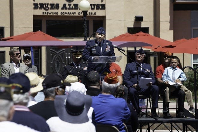 Keynote speakers address a crowd of Puebloans at the 2018 Pueblo Veterans Council Memorial Day observance on the Riverwalk.