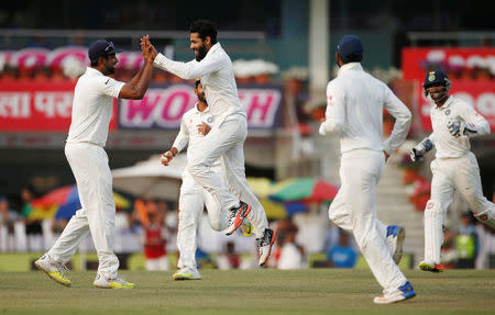 India v Australia - Third Test cricket match - Jharkhand State Cricket Association Stadium, Ranchi, India - 19/03/17 - India's Ravindra Jadeja (2nd L) celebrates with his teammates after dismissing Australia's Nathan Lyon. REUTERS/Adnan Abidi