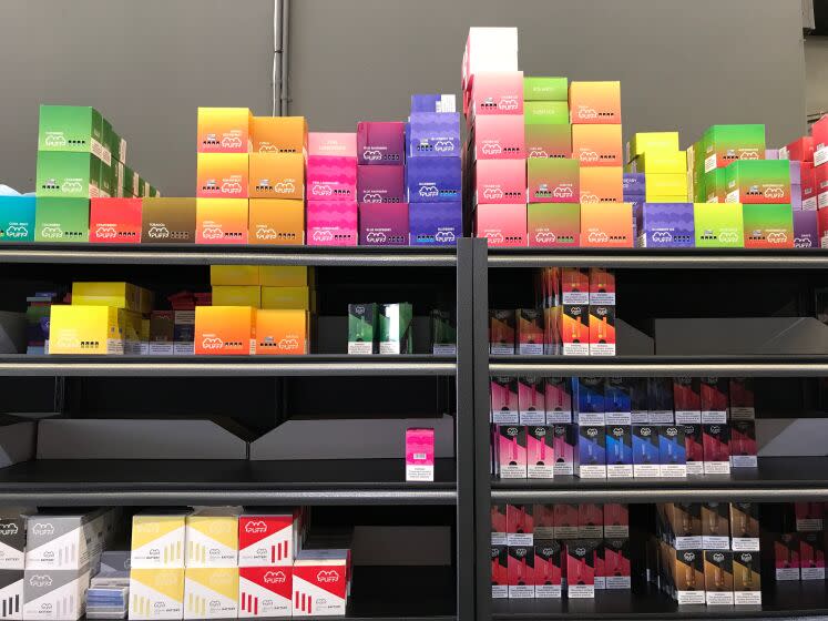 Flavored vaping products containing nicotine are seen in a store in Los Angeles, California, September 17, 2019. - New York became the second US state to ban flavored e-cigarettes Tuesday, following several deaths linked to vaping that have raised fears about a product long promoted as less harmful than smoking. (Photo by Robyn Beck / AFP) (Photo credit should read ROBYN BECK/AFP/Getty Images)