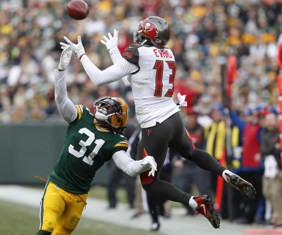 <p>Tampa Bay Buccaneers’ Mike Evans catches a pass over Green Bay Packers’ Davon House during the first half of an NFL football game Sunday, Dec. 3, 2017, in Green Bay, Wis. (AP Photo/Matt Ludtke) </p>