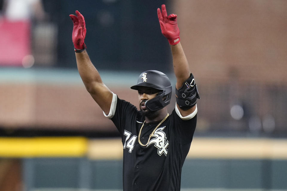 Chicago White Sox's Eloy Jimenez reacts after his RBI double during the first inning of the team's baseball game against the Houston Astros, Friday, March 31, 2023, in Houston. (AP Photo/Eric Christian Smith)
