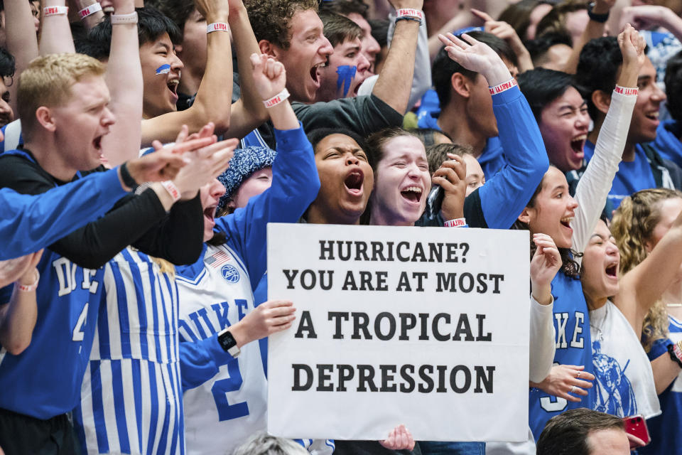 FILE - Duke student fans hold a sign during an NCAA college basketball game against Miami on Saturday, Jan. 21, 2023, in Durham, N.C. Duke’s famously rowdy students spent weeks camping out and getting ready for Saturday’s annual rivalry game with North Carolina. And everyone from successor Jon Scheyer to the “Cameron Crazies" remain determined to preserve the fearsome homecourt advantage that is part of former coach Mike Krzyzewski’s unparalleled legacy. (AP Photo/Jacob Kupferman, File)