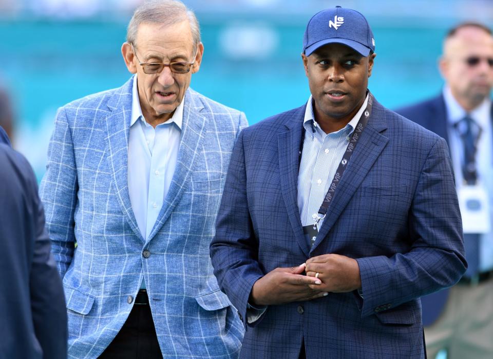 Miami Dolphins owner Stephen M. Ross, left, talks with Miami Dolphins general manager Chris Grier before the start of the game against the Houston Texans at Hard Rock Stadium in Miami Gardens, Nov. 7, 2021. 