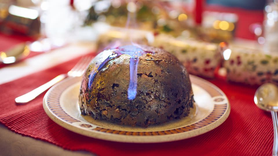 Christmas pudding, sometimes flaming with brandy, finishes the traditional English Christmas feast. - Shutterstock