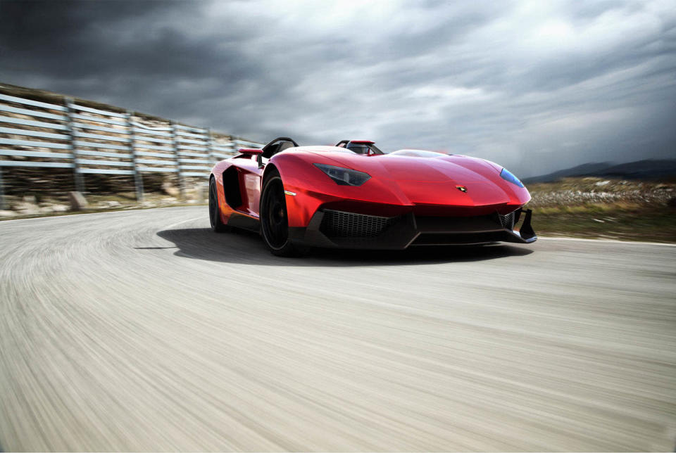 Starting with the everyday 700-hp Aventador, Lamborghini taunted the bull even further by removing the roof, adding several aerodynamic panels and generally shucking weight from a car that only had 3,472 lbs. to begin with. Even the seat fabrics have been swapped for something Lamborghini calls "Carbonskin," a fabric made from carbon fibers that's at least a decade away from being used on a teenager's hat. With no windshield, the interior has to get some form of waterproofing; the rear mirror pops up like Wall-E's head from the center of the dash. It and the roll bars behind the driver are the highest points in the car.