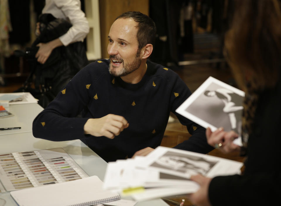 In this Monday, Feb. 3, 2014 photo, Josep Font, creative director of DelPozo, works with his team during a model casting in New York. (AP Photo/Seth Wenig)