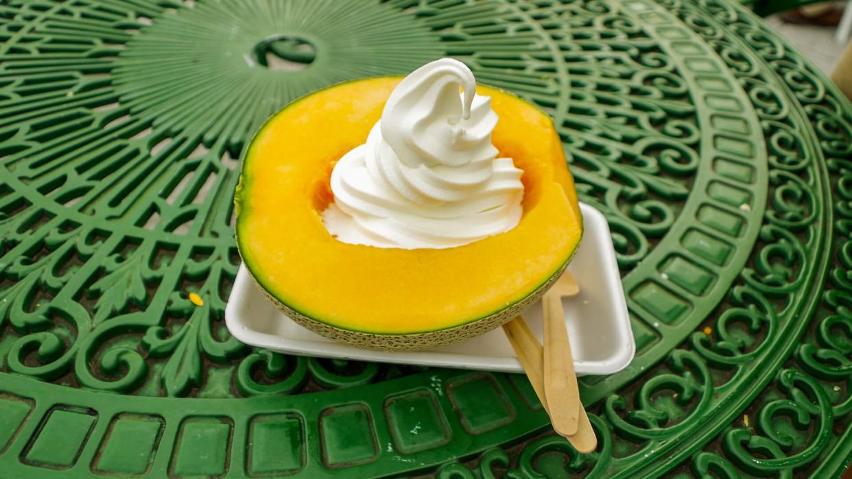 Ice cream soft serve served in half a slice of Yubari King Melon