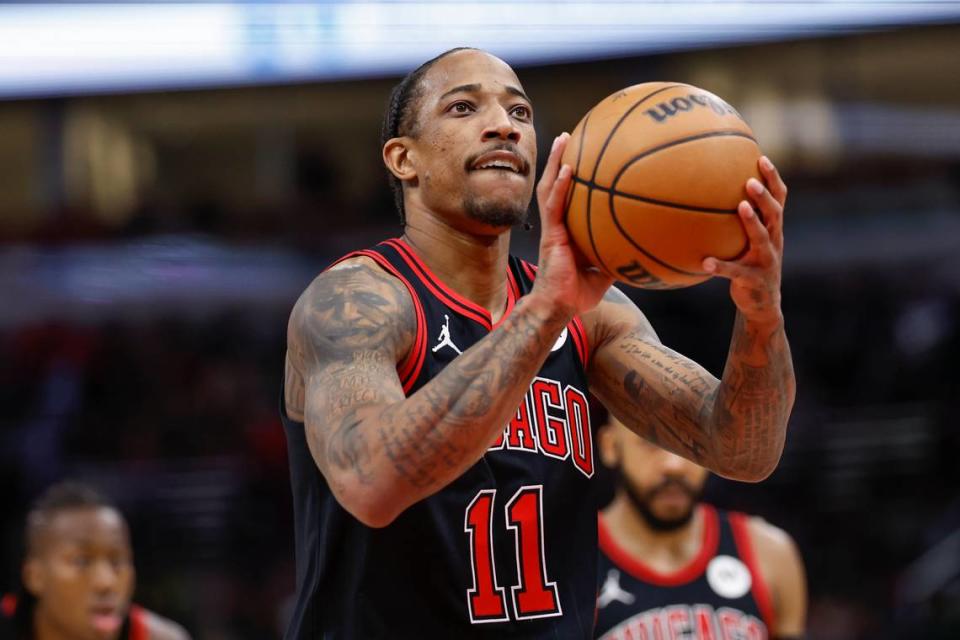 Chicago Bulls forward DeMar DeRozan (11) shoots a free throw against the Philadelphia 76ers in 2023 United Center in Chicago.