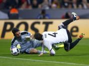 Football Soccer - Germany v Italy - International Friendly - Allianz-Arena, Munich, Germany - 29/3/16 Germany's Sebastian Rudy is fouled by Italy's goalkeeper Gianluigi Buffon REUTERS/Michael Dalder