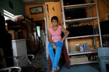 FILE PHOTO: Maria Esis, 52, a kidney disease patient, sits in her house during a blackout in Maracaibo, Venezuela April 11, 2019. REUTERS/Ueslei Marcelino