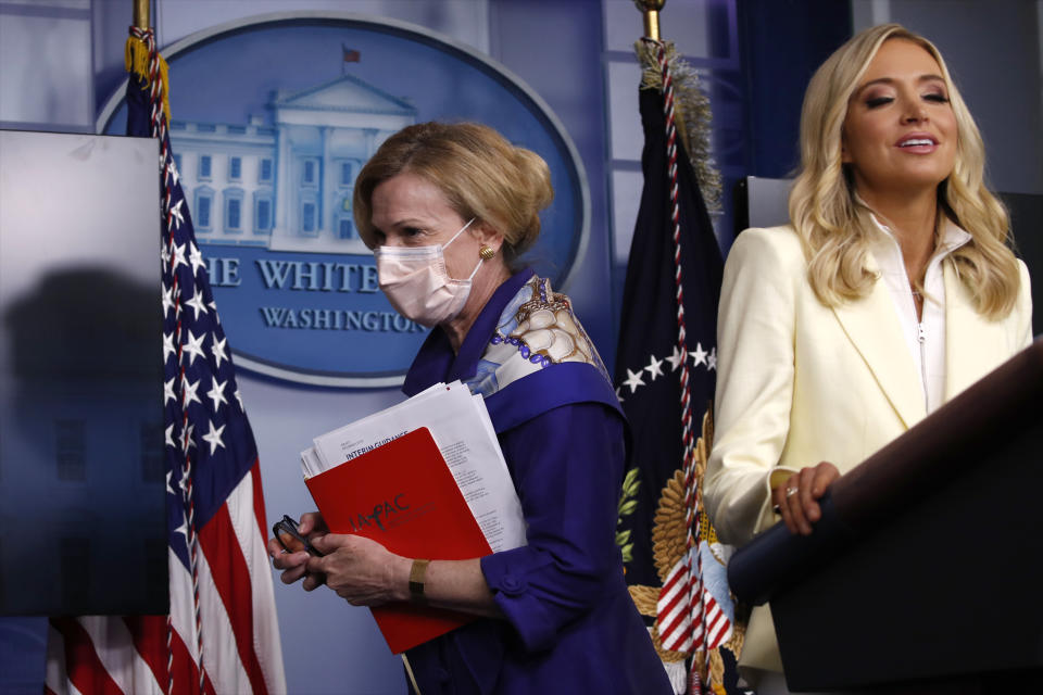 Dr. Deborah Birx, White House coronavirus response coordinator, leaves after speaking with reporters about the coronavirus in the James Brady Briefing Room of the White House, Friday, May 22, 2020, in Washington, as White House press secretary Kayleigh McEnany talks at the podium. (AP Photo/Alex Brandon)