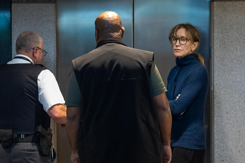 Felicity Huffman in FBI custody on Tuesday. She is charged with felony conspiracy to commit mail fraud and honest services mail fraud, according to a complaint. She posted $250,000 bond and was released. (Photo: Getty Images)