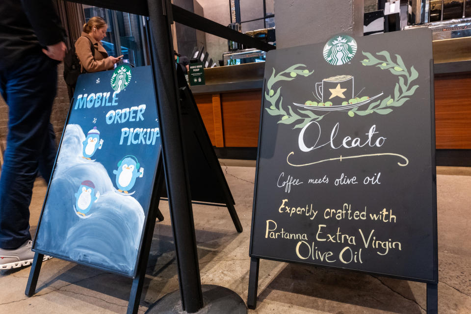 NEW YORK, NEW YORK - JANUARY 30: Starbucks advertises their new live oil-infused drinks at store in Manhattan on January 30, 2024 in New York City. The global coffee chain officially introduced its extra virgin olive oil-infused drinks on Tuesday. Named Oleato, the drinks debuted in Italy in February 2023 and arrive in stores on the same day Starbucks will report fourth-quarter earnings. (Photo by Spencer Platt/Getty Images)