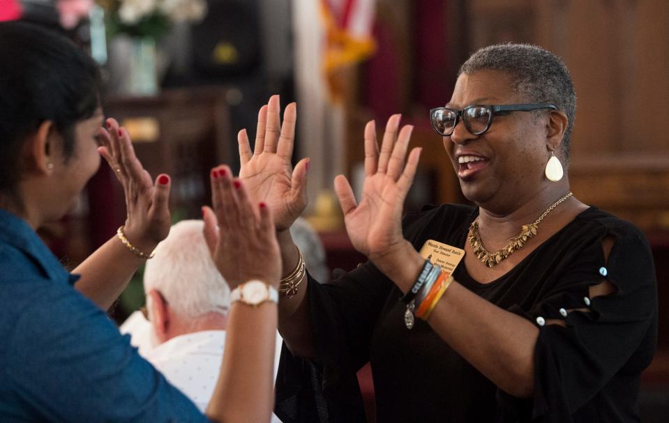 Tour director Wanda Battle talks with tourists at Dexter Avenue King Memorial Baptist Church in Montgomery  on Oct. 22, 2019.