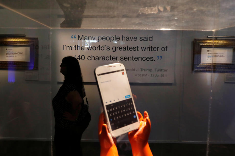 A local resident attends the opening of the "Donald J. Trump Presidential Twitter Library," a comedic installation showcasing U.S. President Donald Trump's Twitter history in downtown Washington D.C., U.S. June 14, 2019. REUTERS/Carlos Barria