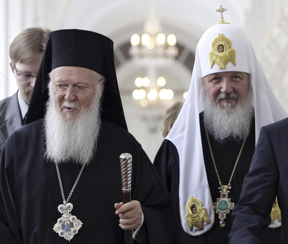 FILE - In this Tuesday, May 25, 2010 file photo, Ecumenical Patriarch Bartholomew I of Constantinople, left, and Russian Orthodox Patriarch Kirill tour the Kremlin during a meeting in Moscow, Russia. The Russian Orthodox Church warned Friday Sept. 28, 2018, that it would sever ties with the leader of the worldwide Orthodox community if he grants autonomy to Ukraine's Orthodox Church. (Dmitry Astakhov, Sputnik, Government Pool Photo via AP, file)