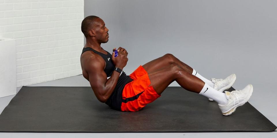 yusuf jeffers trainer performing a situp, crunches vs situps