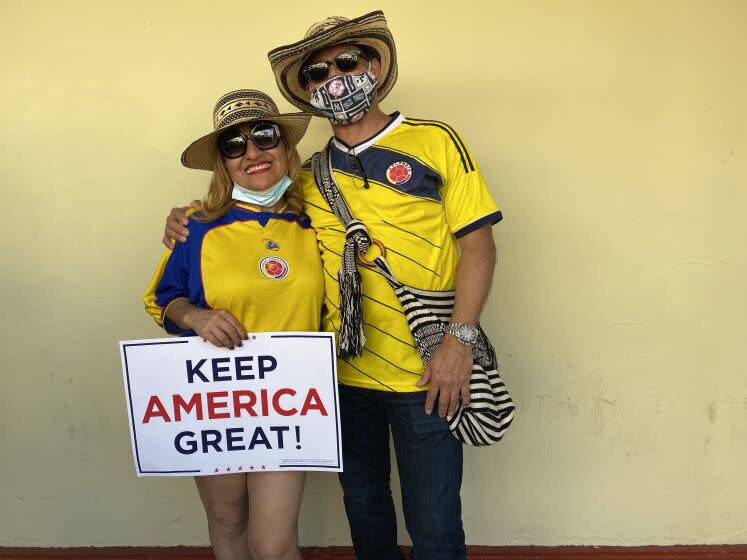 Karem Yepez and Alfredo Zapata celebrate the renaming of a Miami street to "Alvaro Uribe Way."