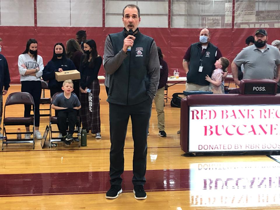 Red Bank Regional boys basketball coach Scott Martin speaks to the crowd following his last home game as the coach of the Bucs.