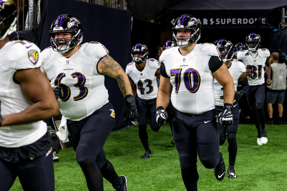 Nov 7, 2022; New Orleans, Louisiana, USA; Baltimore Ravens center <a class="link " href="https://sports.yahoo.com/nfl/players/32997" data-i13n="sec:content-canvas;subsec:anchor_text;elm:context_link" data-ylk="slk:Trystan Colon;sec:content-canvas;subsec:anchor_text;elm:context_link;itc:0">Trystan Colon</a> (63) and guard Kevin Zeitler (70) and running back <a class="link " href="https://sports.yahoo.com/nfl/players/31945" data-i13n="sec:content-canvas;subsec:anchor_text;elm:context_link" data-ylk="slk:Justice Hill;sec:content-canvas;subsec:anchor_text;elm:context_link;itc:0">Justice Hill</a> (43) run out the tunnel against the <a class="link " href="https://sports.yahoo.com/nfl/teams/new-orleans/" data-i13n="sec:content-canvas;subsec:anchor_text;elm:context_link" data-ylk="slk:New Orleans Saints;sec:content-canvas;subsec:anchor_text;elm:context_link;itc:0">New Orleans Saints</a> during the warm ups at Caesars Superdome. Mandatory Credit: Stephen Lew-USA TODAY Sports