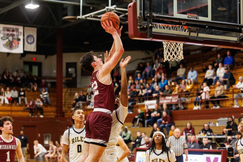 Mishawaka's Cooper Pritchett (12) goes up for a shot during the Mishawaka-South Bend Riley-high school 4A sectional championship basketball game on Saturday, March 02, 2024, at Mishawaka High School in Mishawaka, Indiana.