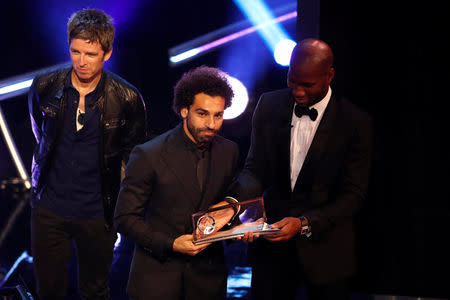 Soccer Football - The Best FIFA Football Awards - Royal Festival Hall, London, Britain - September 24, 2018 Liverpool's Mohamed Salah is presented with the Fifa Puskas award by Noel Gallagher and Didier Drogba Action Images via Reuters/John Sibley