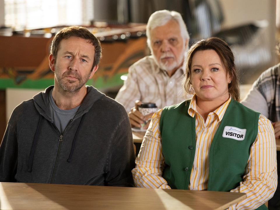 Chris O’Dowd and Melissa McCarthy sitting at a table together in Netflix's "The Starling"