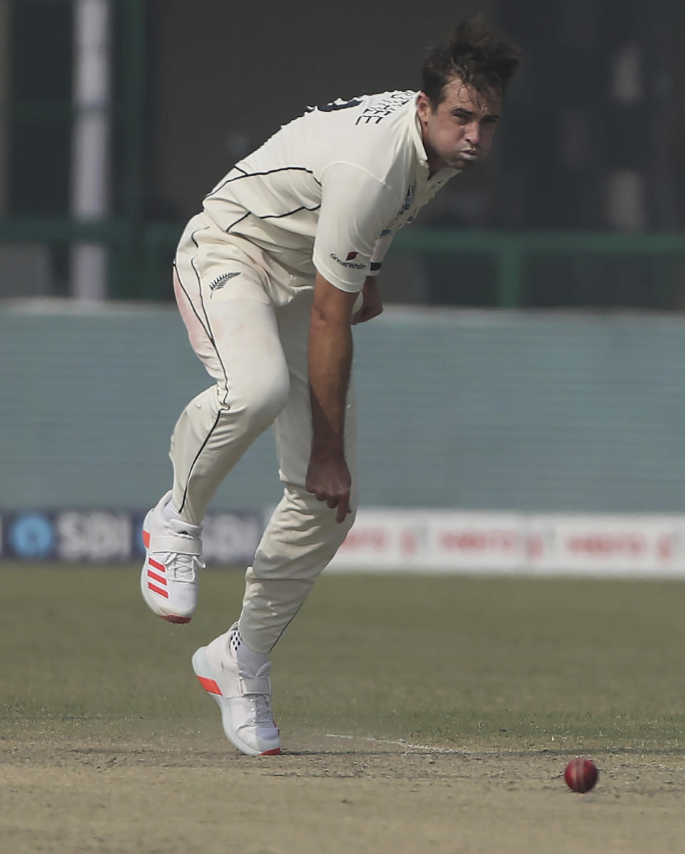 New Zealand's Tim Southee bowls during the day four of their first test cricket match with India in Kanpur, India, Sunday, Nov. 28, 2021. (AP Photo/Altaf Qadri)