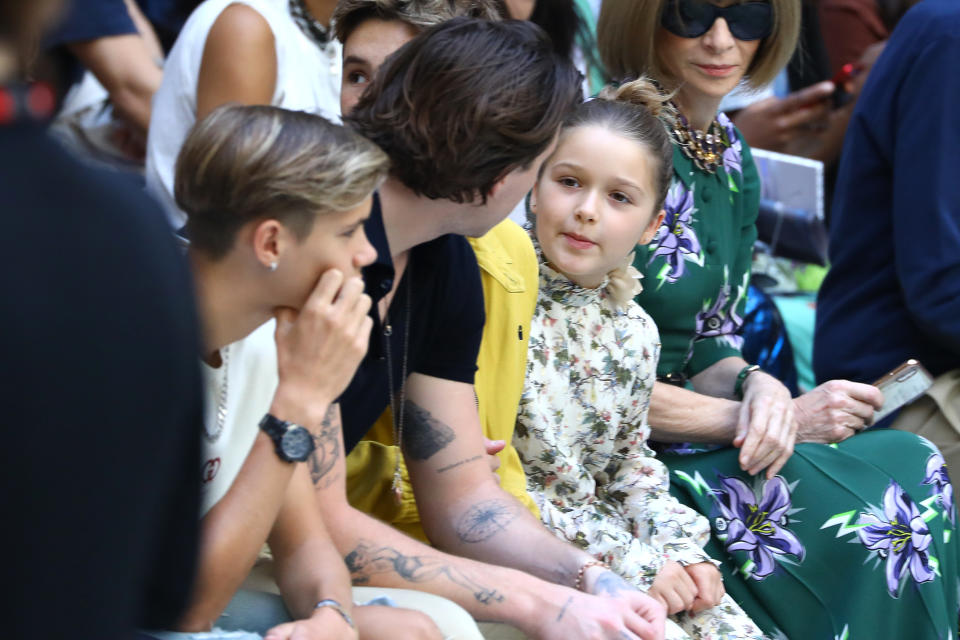 LONDON, ENGLAND - SEPTEMBER 15:  (L-R) Romeo Beckham, Brooklyn Beckham, Harper Seven Beckham and Anna Wintour attend the Victoria Beckham show during London Fashion Week September 2019 at the British Foreign and Commonwealth Office on September 15, 2019 in London, England. (Photo by Tim Whitby/BFC/Getty Images)