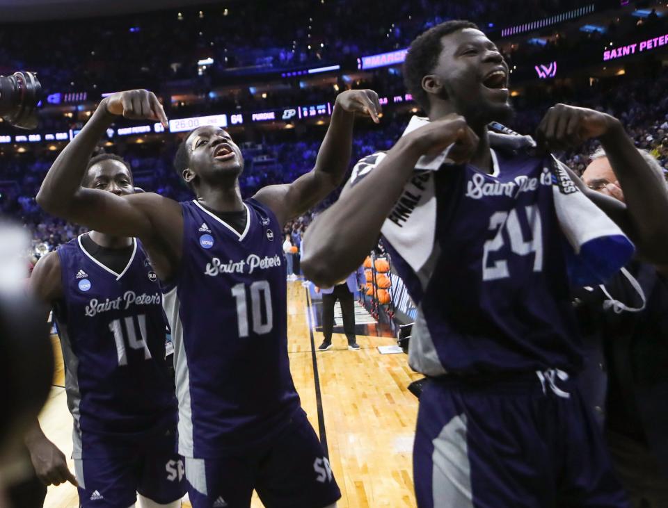 Saint Peter's (from left) Hassan Drame, Fousseyni Drame and Oumar Diahame leave the court after the Peacocks' 67-64 win against Purdue to advance to the Elite Eight in the NCAA tournament at the Wells Fargo Center in Philadelphia, March 25, 2022. Twins Hassan and Fousseyni Drame have transferred to La Salle.