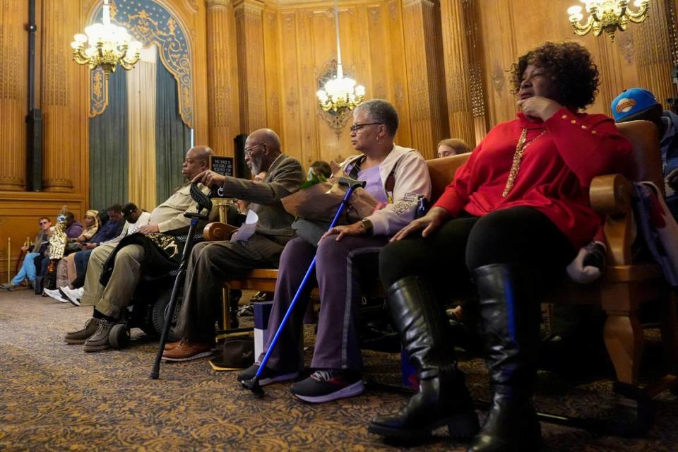 San Francisco NAACP President Amos Brown, third from right, listens at a San Francisco Board of Supervisors meeting at City Hall, Tuesday, Feb. 27, 2024, in San Francisco. Supervisors in San Francisco formally apologized Tuesday to African Americans and their descendants for the city’s role in perpetuating racism and discrimination. (AP Photo/Godofredo A. Vásquez)