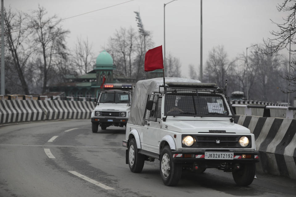 Security vehicles of Indian police guard a convoy of New Delhi-based diplomats passing through Srinagar, Indian controlled Kashmir, Thursday, Jan. 9, 2020. Envoys from 15 countries including the United States are visiting Indian-controlled Kashmir starting Thursday for two days, the first by New Delhi-based diplomats since India stripped the region of its semi-autonomous status and imposed a harsh crackdown in early August. (AP Photo/Mukhtar Khan)