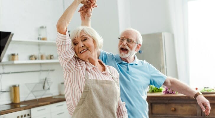 Elderly couple dancing in their kitchen