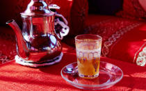 <p>Moroccan green tea, or mint tea, is served with every meal and often comes in small, decorative glasses.</p>