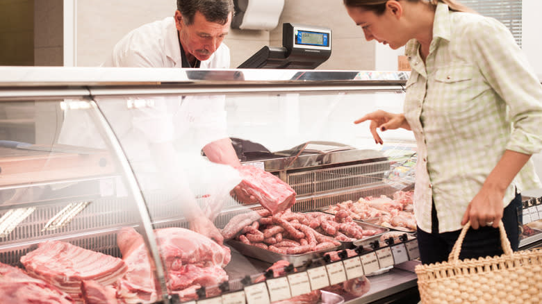 woman buying meat