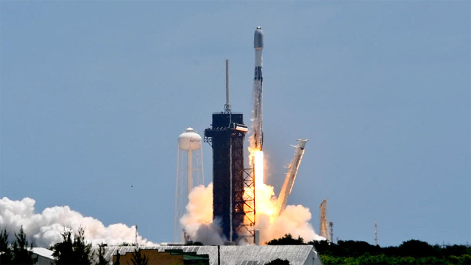 SpaceX launches the first of three planned Falcon 9 flights in less than two days, boosting 53 more Starlink internet satellites into orbit Friday from the Kennedy Space Center. The company plans a California launch Saturday morning and another Florida flight early Sunday, setting a new U.S. commercial space launch record. / Credit: William Harwood/CBS News