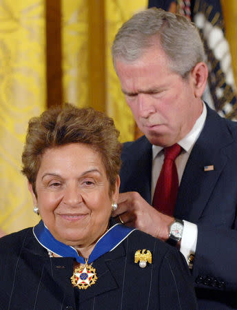 FILE PHOTO: U.S. President George W. Bush (R) awards the Medal of Freedom to University of Miami, Florida, U.S., President Donna Shalala (L), former U.S. Secretary of Health and Human Services, during a ceremony at the White House in Washington June 19, 2008. REUTERS/Jonathan Ernst/File Photo