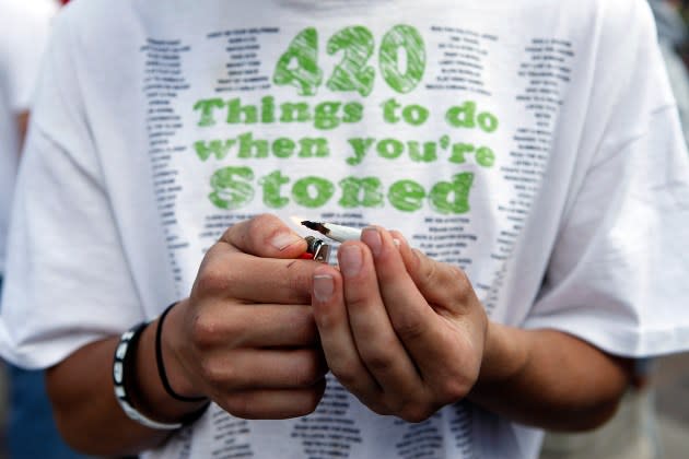 Tyler Shumway of Aurora, Colorado lights up a joint as thousands gathered to celebrate the state's medicinal marijuana laws and collectively light up at 4:20 p.m. in Civic Center Park April 20, 2012 in Denver, Colorado. Colorado goes to the polls November 6 to vote on a controversial ballot initiative that would permit possession of up to an ounce of marijuana for those 21 and older.  - Credit: Marc Piscotty/Getty Images